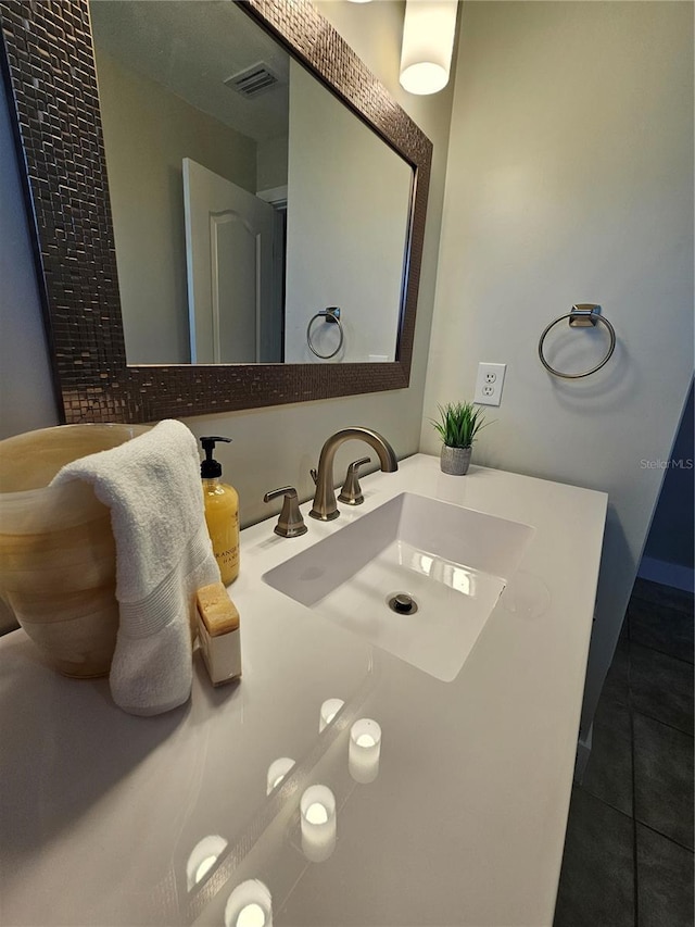 bathroom with tile patterned flooring and sink