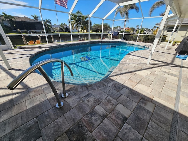 view of pool featuring a lanai and a patio