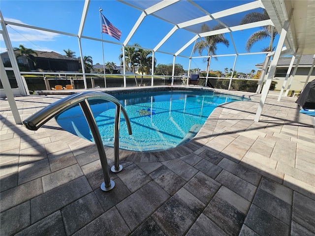 view of pool with a lanai and a patio