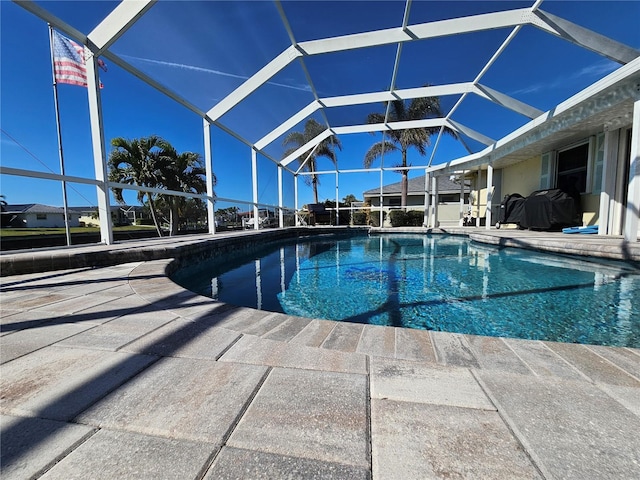 view of pool with a lanai and a patio area