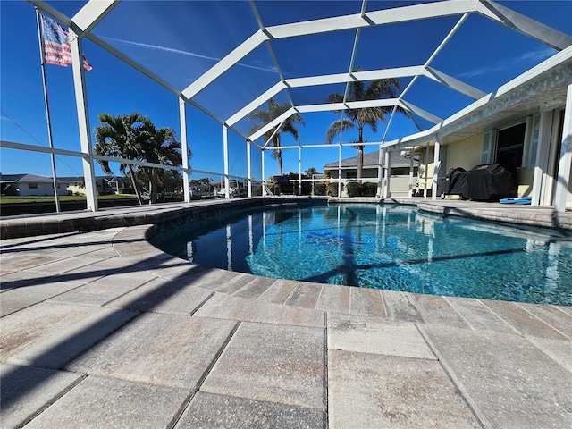 view of pool with a lanai and a patio area