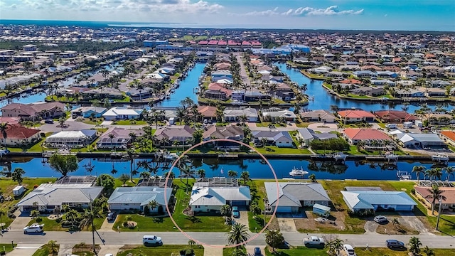 bird's eye view with a residential view and a water view