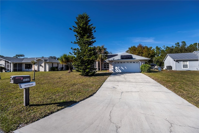 single story home featuring a garage and a front lawn