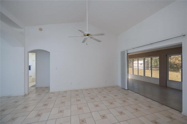 spare room featuring ceiling fan and high vaulted ceiling