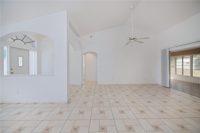 unfurnished room featuring ceiling fan and high vaulted ceiling