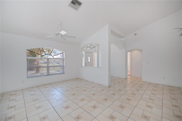 unfurnished room featuring ceiling fan and high vaulted ceiling