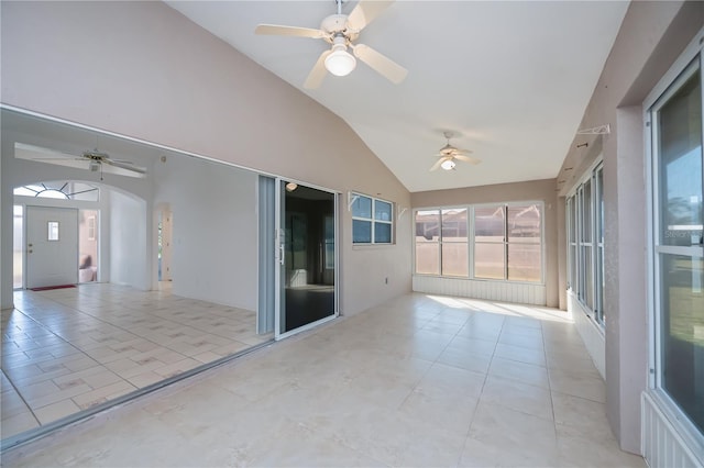 unfurnished sunroom with ceiling fan and lofted ceiling