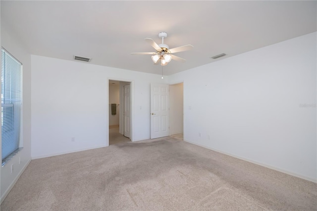 carpeted empty room with ceiling fan