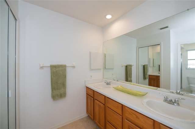 bathroom with vanity and toilet