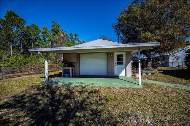 garage with a yard