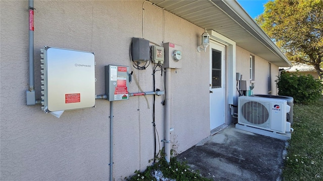 view of side of home with ac unit