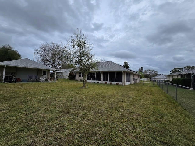 view of yard featuring a sunroom