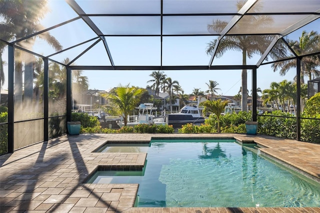 view of pool with a lanai, a patio area, and a jacuzzi