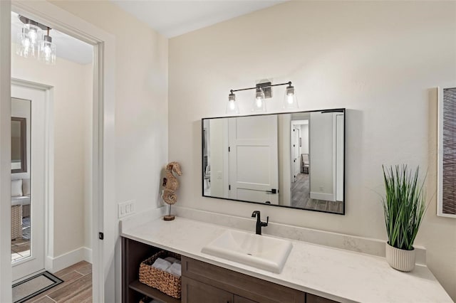 bathroom featuring vanity and hardwood / wood-style floors