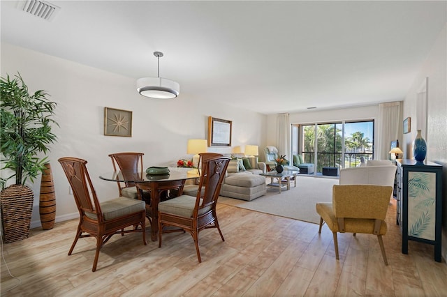 dining room with light hardwood / wood-style flooring