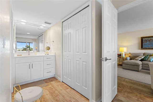 bathroom featuring vanity and hardwood / wood-style flooring