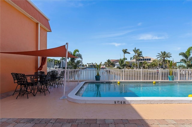 view of swimming pool with a patio area