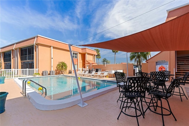 view of swimming pool with a patio area