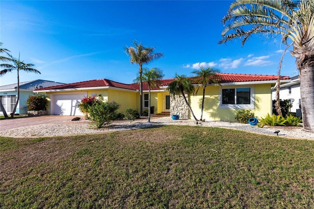 ranch-style home with a garage and a front lawn