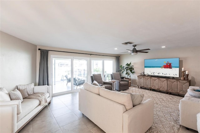 living room with light tile patterned flooring and ceiling fan