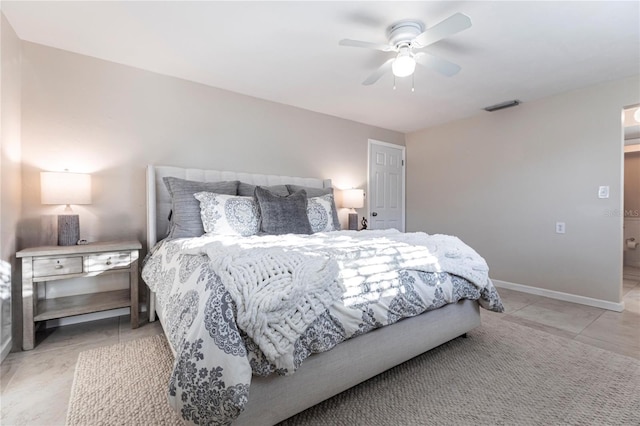 tiled bedroom with ceiling fan