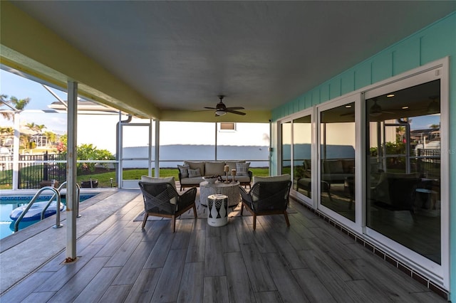 deck featuring ceiling fan and an outdoor living space