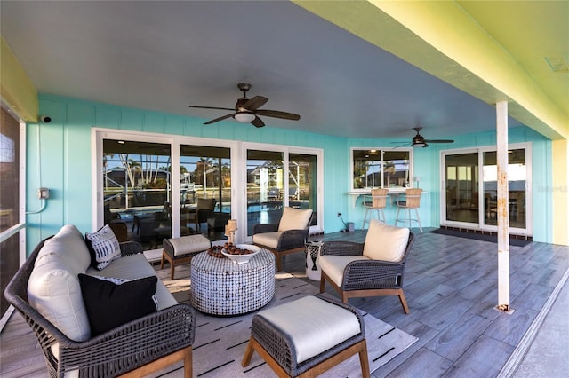 deck featuring an outdoor hangout area and ceiling fan