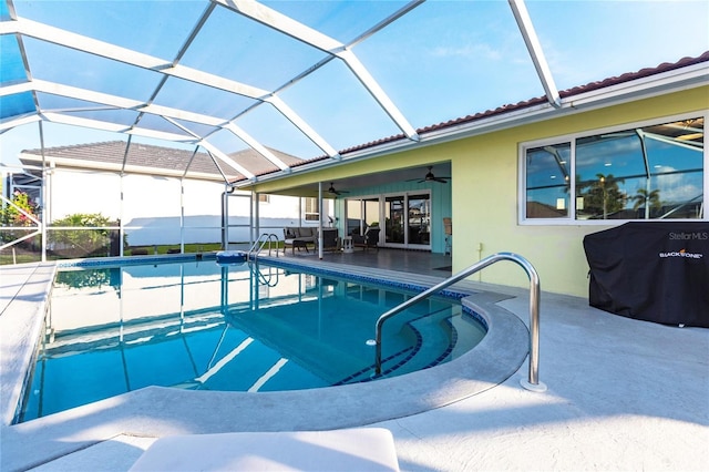 view of pool featuring grilling area, a lanai, ceiling fan, and a patio area