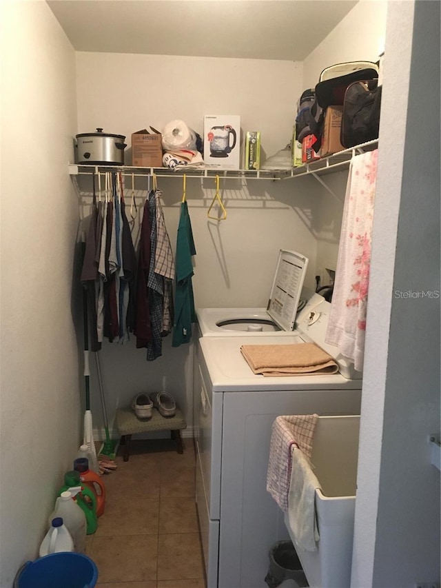 laundry area with tile patterned flooring and washer and dryer