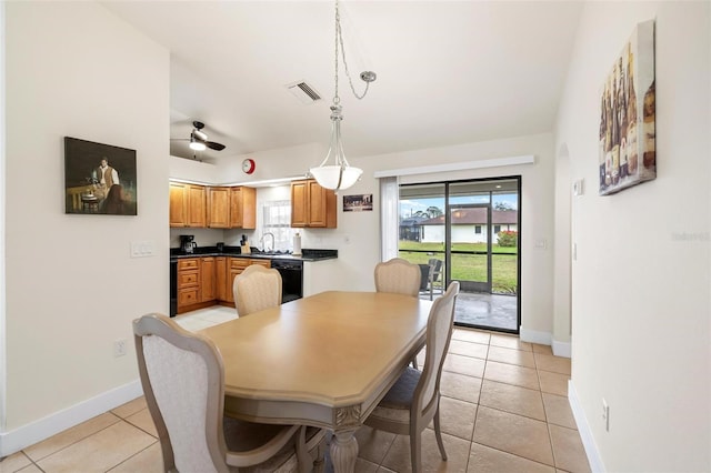 tiled dining area featuring sink