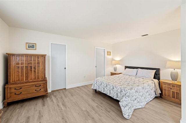 bedroom with light wood-type flooring