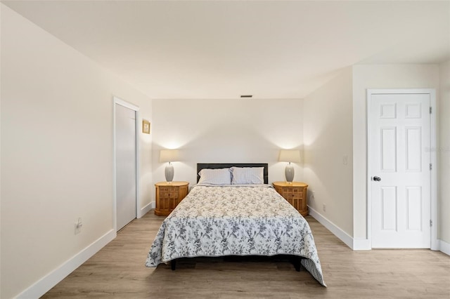 bedroom with light hardwood / wood-style floors