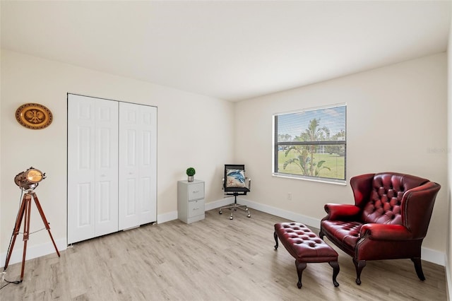 sitting room with light hardwood / wood-style flooring