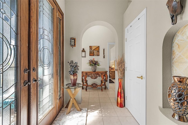 entryway with light tile patterned flooring