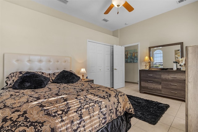 bedroom featuring a closet, ceiling fan, and light tile patterned flooring