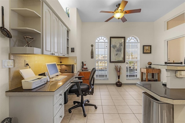 office area with light tile patterned flooring and ceiling fan