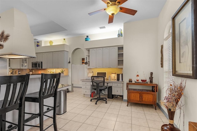 interior space featuring ceiling fan