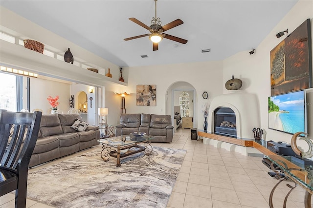 living room featuring ceiling fan and light tile patterned floors