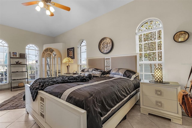 bedroom featuring light tile patterned floors and ceiling fan