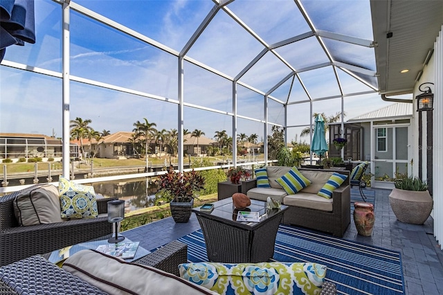 view of patio / terrace with an outdoor living space and glass enclosure