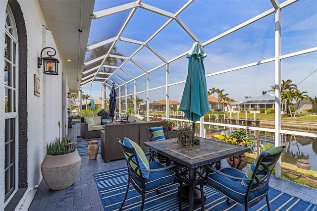 view of patio featuring glass enclosure