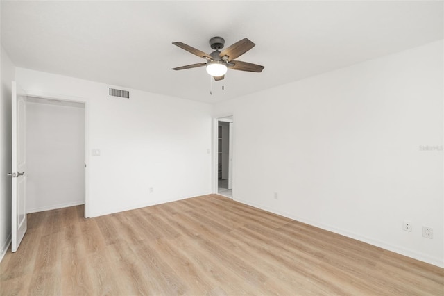 unfurnished room featuring ceiling fan and light hardwood / wood-style flooring