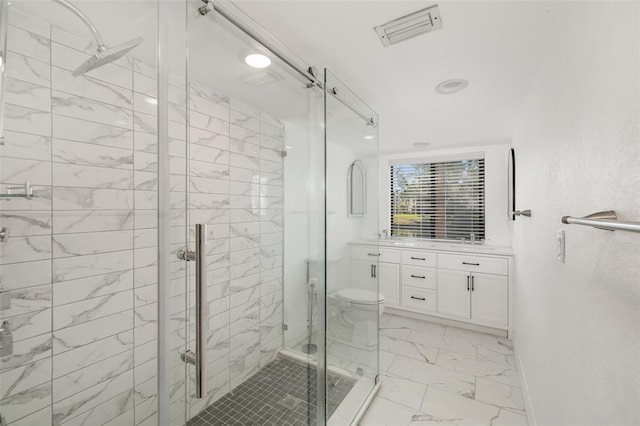 bathroom featuring vanity, toilet, and walk in shower