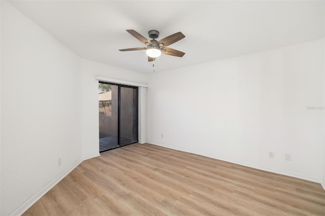 empty room featuring ceiling fan and light hardwood / wood-style floors