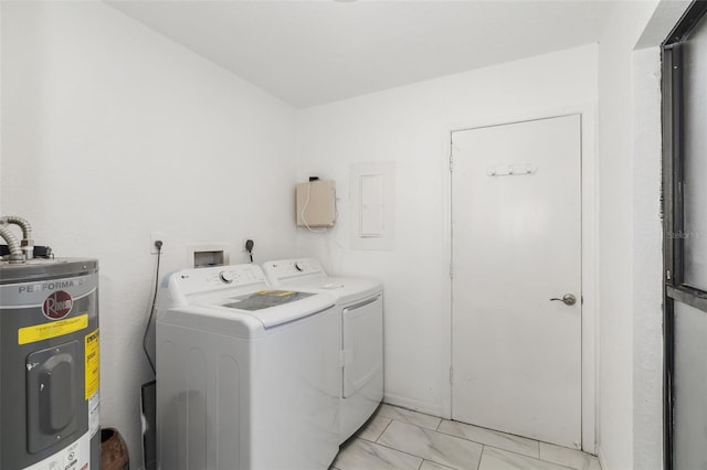 washroom featuring water heater and washer and clothes dryer