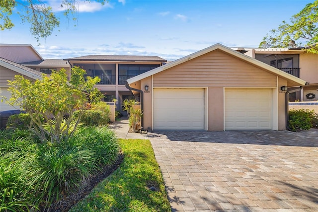 front of property with a garage