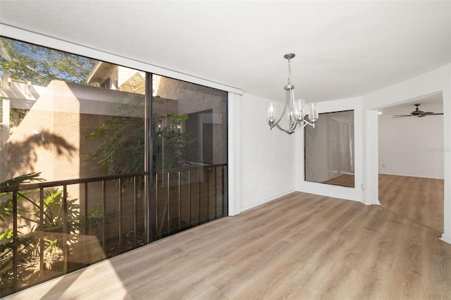 dining area featuring hardwood / wood-style floors and a notable chandelier