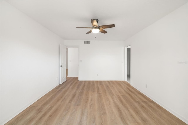 unfurnished room with ceiling fan and light wood-type flooring