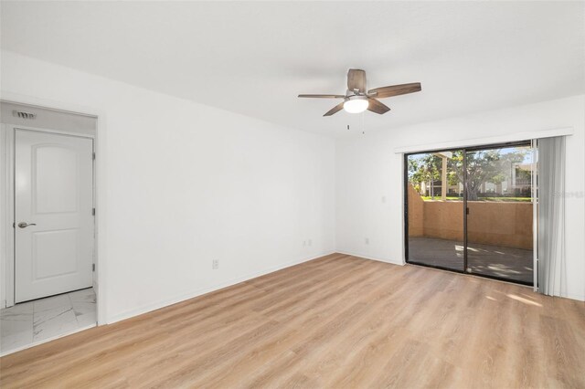 unfurnished room with ceiling fan and light hardwood / wood-style flooring