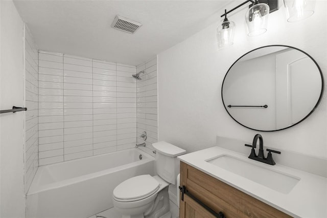 full bathroom with tiled shower / bath combo, vanity, and toilet